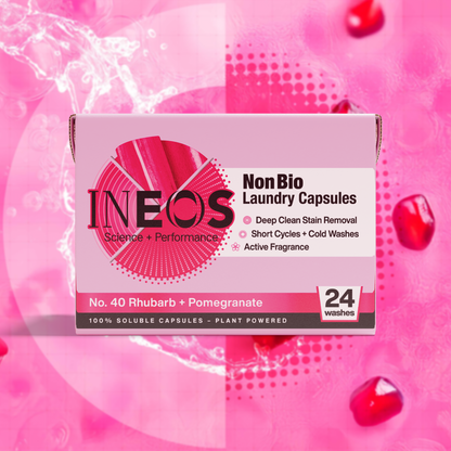 INEOS NonBio Laundry Capsules packaging on a pink background with rhubarb and pomegranate elements.